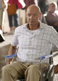 Locke, a middle aged, bald white man in a wheelchair